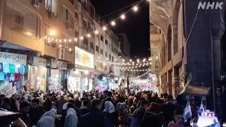 Al-Masri mengirimkan rekaman video perayaan Idulfitri di Homs kepada NHK World pada bulan April, yang menandai berakhirnya Ramadan, bulan suci puasa bagi umat Muslim.